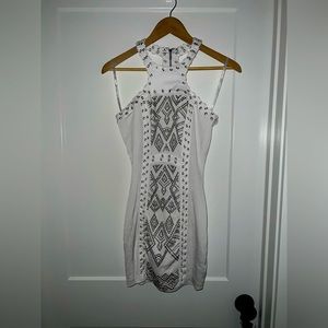 White dress with cord and stud accents. like new.